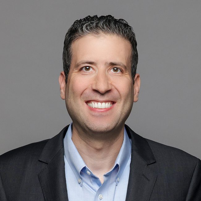 Greg E. Mann